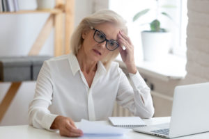 Woman needing investment and financial advise while struggling to do taxes